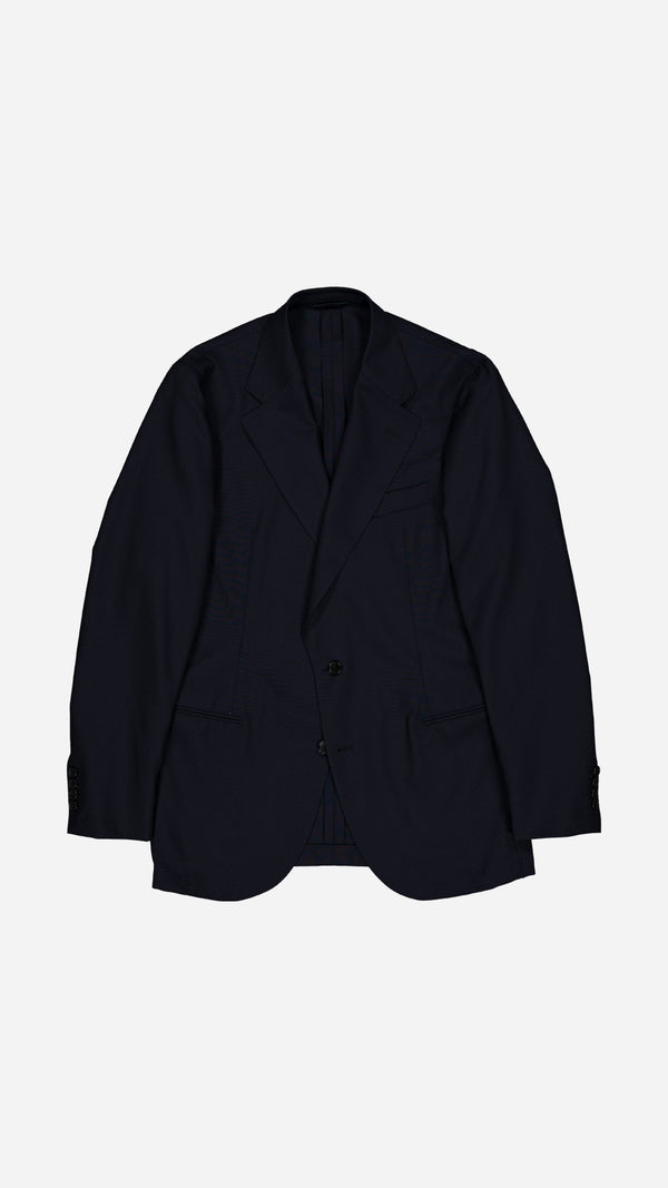 La veste du costume droit Stéphane en fresco bleu nuit, photographiée à plat et vue de haut, de la Maison Gabriel Paris