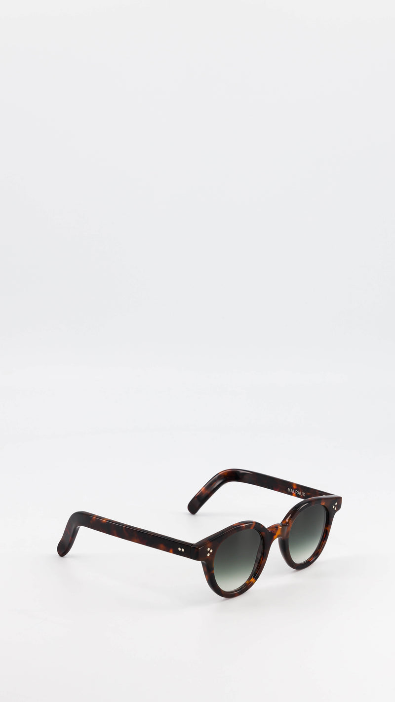 Les lunettes Vincent en acétate marron jaspé verres solaires dégradés, coloris vert, de la collection André Malraux par Maison Gabriel Paris