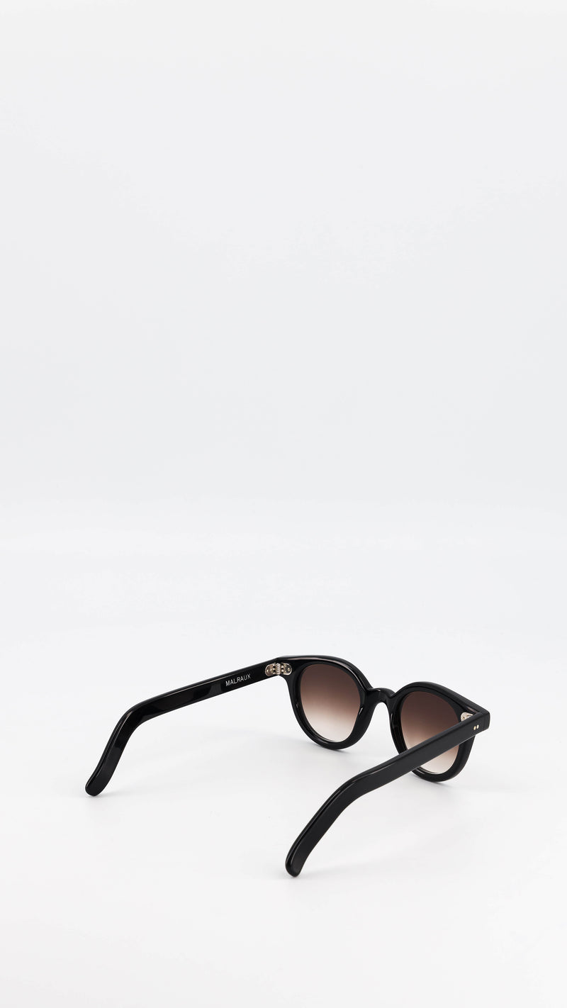 Les lunettes Vincent en acétate noire verres solaires dégradés, coloris marron, de la collection André Malraux par Maison Gabriel Paris