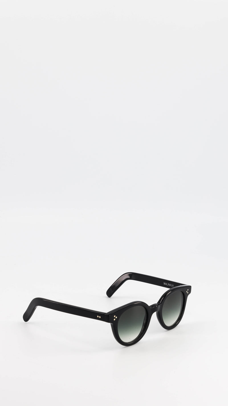 Les lunettes Vincent en acétate noire verres solaires dégradés, coloris vert, de la collection André Malraux par Maison Gabriel Paris
